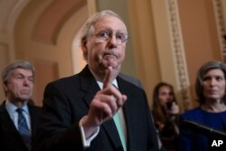 Senate Majority Leader Mitch McConnell, joined by Sen. Roy Blunt, left, and Sen. Joni Ernst, right, dismisses the impeachment process against President Donald Trump saying, "I'm not an impartial juror. This is a political process," Dec. 17, 2019.