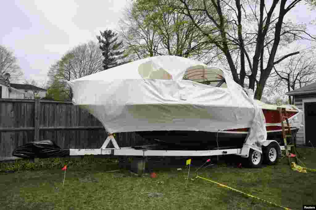 A still image entered as evidence shows the boat where Boston Marathon bombing suspect Dzhokhar Tsarnaev hid after a gunfight with police in this handout photo provided by the U.S. Attorney's Office in Boston, Massachusetts, March 17, 2015. 