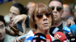 Gisele Pelicot speaks to media as she leaves the Avignon courthouse in southern France, Sept. 5, 2024. Pelicot, who was allegedly drugged by her ex-husband so she could be raped by other men while she laid unconscious, is expected to testify.