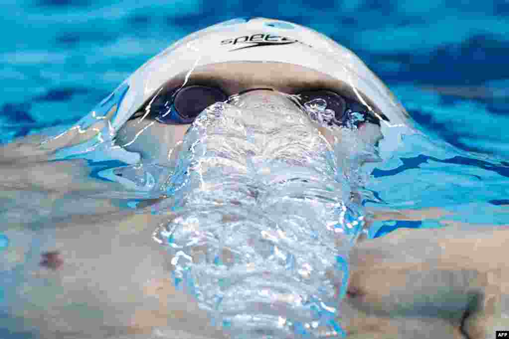 Russia&#39;s Evgeny Rylov competes in a heat for the men&#39;s 200m backstroke swimming event during the Tokyo 2020 Olympic Games at the Tokyo Aquatics Center in Tokyo, Japan.