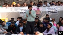 FILE - Bajrang Punia, Indian wrestler who won a Bronze medal at the 2020 Tokyo Olympics, addresses the media during a protest against Wrestling Federation of India President Brij Bhushan Sharan Singh and other officials in New Delhi, India, Jan. 20, 2023.