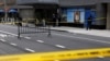 Police officers stand near the scene where United Healthcare CEO Brian Thompson was shot and killed in Midtown Manhattan in New York on Dec. 4, 2024.