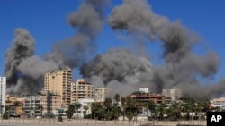 Smoke rises from buildings hit in Israeli airstrikes in Tyre, Lebanon, Oct. 23, 2024.