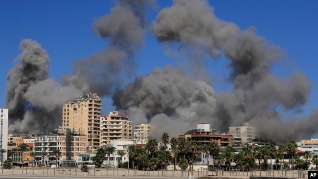 Smoke rises from buildings hit in Israeli airstrikes in Tyre, Lebanon, Oct. 23, 2024.