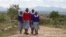 FILE - Students walk near the Imbirikani Girls High School in Imbirikani, Kenya, April 21, 2016.