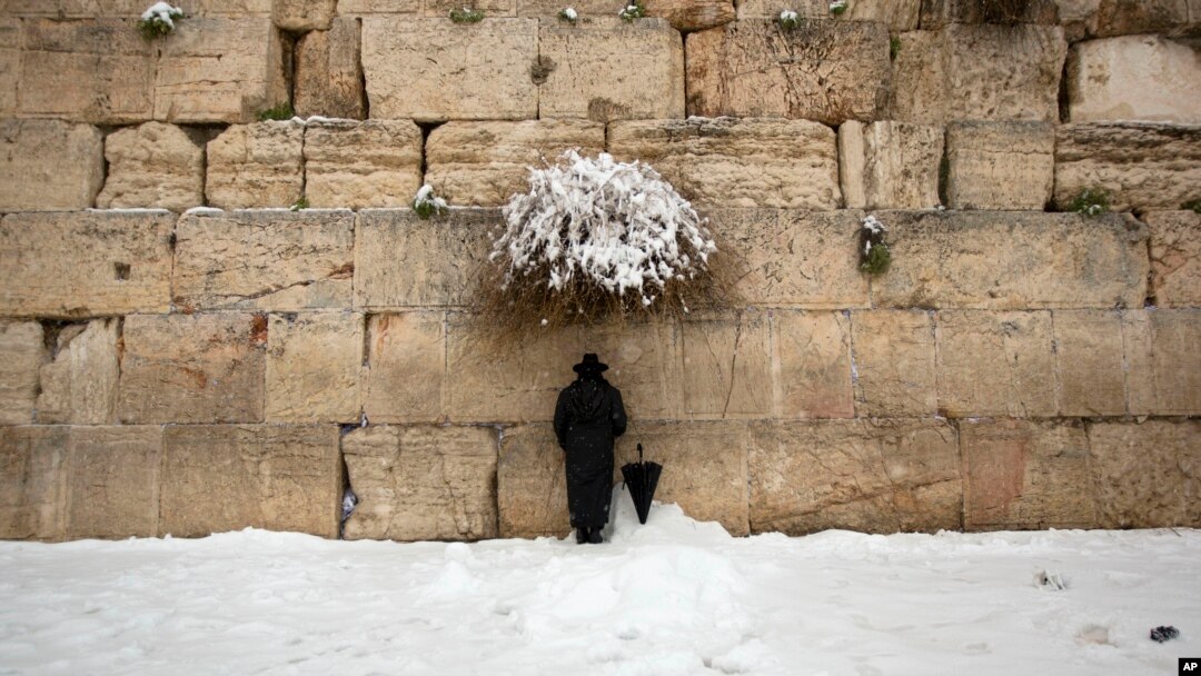FILE - An ultra-Orthodox Jewish man prays at the Western Wall, the holiest site where Jews can pray in Jerusalem's old city, Feb. 20, 2015.