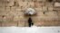 FILE - An ultra-Orthodox Jewish man prays at the Western Wall, the holiest site where Jews can pray in Jerusalem's old city, Feb. 20, 2015.