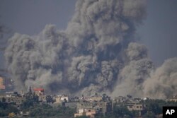 Smoke rises following an Israeli airstrike in the Gaza Strip, as seen from southern Israel, Oct. 23, 2023.