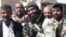 Ayyub Faleh al-Rubaie (C), known as Abu Azrael - Father of the Angel of Death - poses with Shiite fighters at the Speicher military base, near the northern Iraqi city of Tikrit, March 14, 2015.