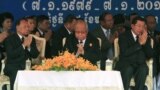 Cambodian Prime Minister Hun Sen, right, prays with President of the Cambodian National Assembly Heng Samrin, left, and Senate President Chea Sim, center, during a celebration marking the 34th anniversary of the 1979 downfall of the Khmer Rouge regime, in Phnom Penh, Cambodia, Monday, Jan. 7, 2013. (AP Photo/Heng Sinith)