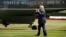 FILE - President Donald Trump walks on the South Lawn of the White House in Washington to board Marine One helicopter for a short trip to Andrews Air Force Base, Maryland, en route to Bedminster, N.J., for vacation, Aug. 4, 2017.