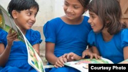 Children in Bangladesh with books supplied by Room to Read. (Room to Read) 