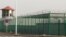 FILE - In this Dec. 3, 2018, file photo, a guard tower and barbed wire fence surround a detention facility in the Kunshan Industrial Park in Artux in western China's Xinjiang region.