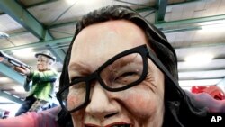 FILE - A figure depicting then-leader Andrea Nahles of the German Social Democrats is shown during a press preview in a hall of the Mainz carnival club in Mainz, Germany, Feb. 26, 2019. 