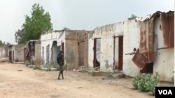 FILE - Houses destroyed during battles with Boko Haram are seen in Kousseri, Cameroon, June 11, 2019. Dozens of people have fled their villages after a suicide bombing April 5, 2020, reignited fears of infiltration by Boko Haram terrorists.