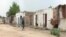 FILE - Houses destroyed during battles with Boko Haram are seen in Kousseri, Cameroon, June 11, 2019. Dozens of people have fled their villages after a suicide bombing April 5, 2020, reignited fears of infiltration by Boko Haram terrorists.
