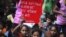 Children hold placards as they participate in a protest organized by non-governmental organization Bachpan Bachao Andolan, or Save Childhood Movement, against the death of schoolchildren after eating a meal served at a school, in New Delhi, July 20, 2013.