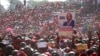 Movement for Democratic Change (MDC) supporters hold a poster of leader Nelson Chamisa during the party's 19th-anniversary celebrations in Harare, Zimbabwe, Saturday, Oct. 27, 2018.