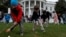 FILE - Children participate in the annual White House Easter Egg Roll on the South Lawn of the White House in Washington, April 2, 2018. The event has been on hiatus the past two years due to the COVID-19 pandemic.