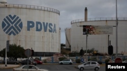 The logo of Venezuelan oil company PDVSA is seen on a tank at Isla refinery in Willemstad on the island of Curacao, April 22, 2018.