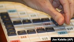 FILE - National SCRABBLE Champion Nigel Richards spells F-O-V-E-A-E (a part of the eye) in the final game of the competition at the Royal Pacific Resort in Orlando, Florida, on July 29, 2008. (Joe Kaleita/AP Images/SCRABBLE)