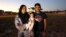 FILE - Ferzanah Essack, 36, a software developer, and her husband Hassan Essack, 37, a software developer, pose for a portrait with their 4-month-old baby Salma on the morning of Ferzanah's first day back to work, in Cape Town, South Africa, Feb. 18, 2019.
