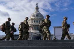 National Guard troops reinforce security around the U.S. Capitol ahead of the inauguration of President-elect Joe Biden and Vice President-elect Kamala Harris, Jan. 17, 2021.