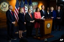 House Speaker Nancy Pelosi of Calif., speaks during a news conference to announce impeachment managers on Capitol Hill in Washington, Wednesday, Jan. 15, 2020. With Pelosi from left are Rep. Hakeem Jeffries, D-N.Y., Rep. Sylvia Garcia, D-Texas,…