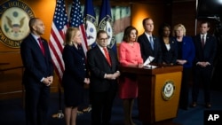 House Speaker Nancy Pelosi, center, announces the impeachment managers, from left, Reps. Hakeem Jeffries, Sylvia Garcia, Jerrold Nadler, Adam Schiff, Val Demings, Zoe Lofgren and Jason Crow, on Capitol Hill in Washington, Jan. 15. 2020.