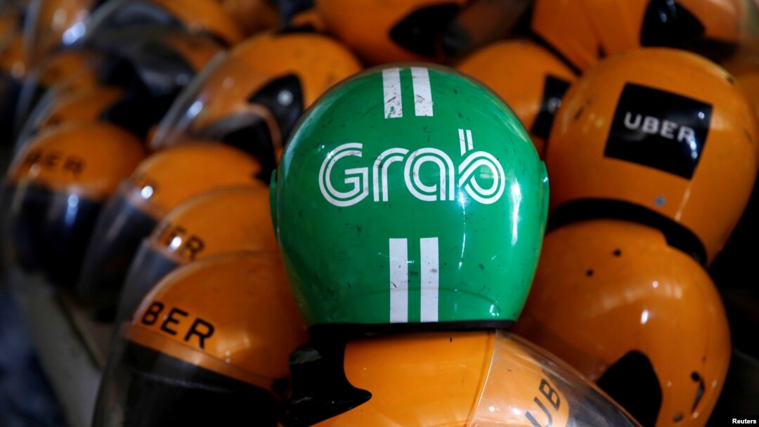 Grab và Uber thông báo thỏa thuận mua bán tuần trước.