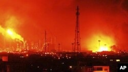 Balls of fire rise over Amuay refinery near Punto Fijo, Venezuela, August 25, 2012. 