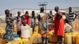 FILE - Residents of the Mangateen Camp for the internally displaced line up for water from a borehole, on the outskirts of the capital Juba, South Sudan, Jan. 22, 2019. 