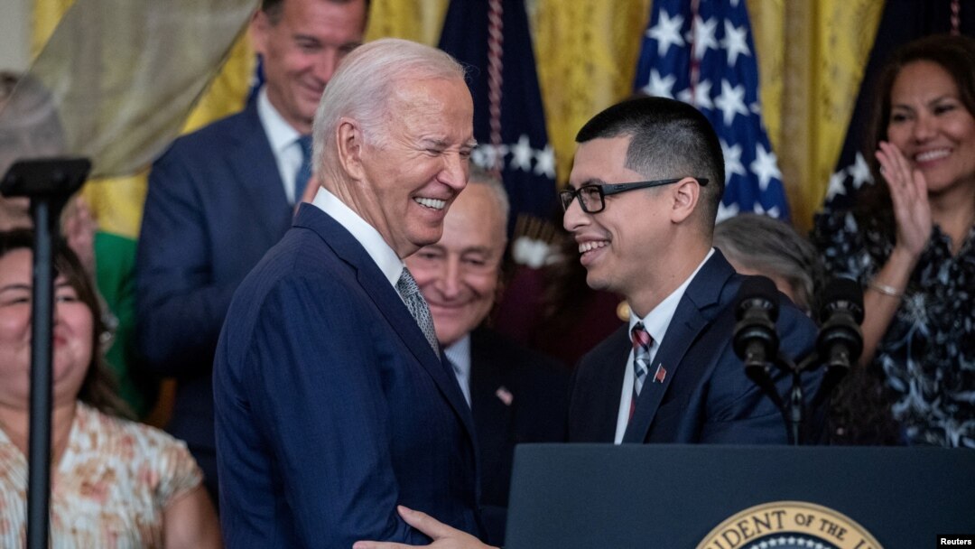 DACA recipient Javier Quiroz Castro introduces U.S. President Joe Biden, before the announcement of immigration relief for spouses of U.S. citizens, coinciding with the 12th anniversary of the Deferred Action for Childhood Arrivals program in Washington, June 18, 2024.