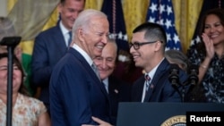 DACA recipient Javier Quiroz Castro introduces U.S. President Joe Biden, before the announcement of immigration relief for spouses of U.S. citizens, coinciding with the 12th anniversary of the Deferred Action for Childhood Arrivals program in Washington, June 18, 2024.