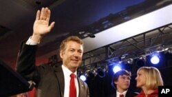 Rand Paul, a favorite of the Tea Party movement, waves to supporters after winning election as a Republican to the Senate from Kentucky