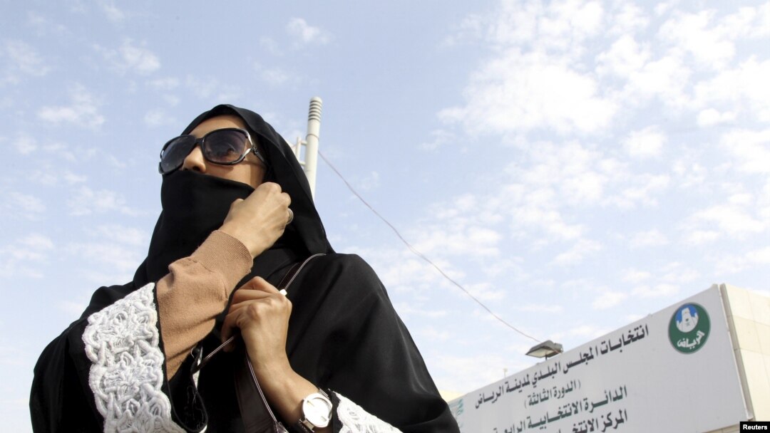 Saudi woman leaves polling station after casting vote during municipal elections in Riyadh, Saudi Arabia, Dec. 12, 2015.