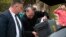 FILE - Police execute a search warrant on the home of an Australian intelligence officer in Canberra, Australia, Sept. 4, 2019. News Corp. Australia executive Campbell Reid linked the raid to the June 4 raid on journalist Annika Smethurst’s home.
