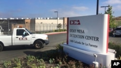 FILE - In this June 9, 2017, file photo, a vehicle drives into the Otay Mesa detention center in San Diego, Calif. The American Civil Liberties Union filed a class-action lawsuit March 9, 2018, accusing the U.S. government of broadly separating immigrant families seeking asylum. 