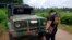 Police inspect a vehicle at a military checkpoint where a bomb exploded in Lamitan, Basilan province, southern Philippines, July 31, 2018.