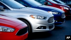 FILE - Ford Fusions are for sale on the lot at Butler County Ford in Butler, Pennsylvania, in November 2015. Ford Motor Co. has built the midsize Fusion sedan at its plant in Hermosillo, Mexico, since its introduction in 2005. 