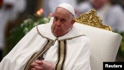 FILE - Pope Francis attends the Vespers prayer service to celebrate the conversion of Saint Paul, at St Paul's Basilica in Rome, Italy, January 25, 2024.