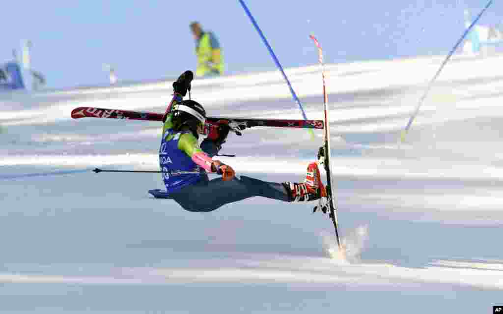 Maryna Gasienica Daniel of Poland falls as she competes during an Alpine skiing, women's World Cup Giant Slalom event, in Lienz, Austria.