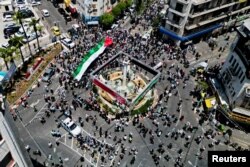 Warga Palestina saat unjuk rasa saat mereka memperingati 75 tahun Nakba di Ramallah di Tepi Barat yang diduduki Israel pada 15 Mei 2023. (Foto: REUTERS/ Mohammed Torokman)