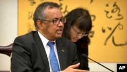 Tedros Adhanom Ghebreyesus, director general of the World Health Organization (WHO), speaks during a meeting with Chinese Foreign Minister Wang Yi at the Ministry of Foreign Affairs in Beijing, Tuesday, July 17, 2018. (AP Photo/Mark Schiefelbein, Pool)