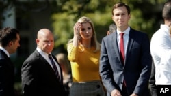 FILE - Ivanka Trump, the daughter of and assistant to President Donald Trump, and her husband, White House senior adviser Jared Kushner, walk on the South Lawn of the White House in Washington, Oct. 2, 2017.