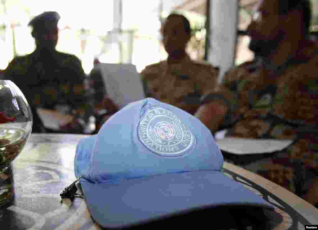 A blue United Nations cap is left near members of the U.N. observers mission in Syria, who have left their bases in the province of Homs in Central Syria, as they check their departure dates in a hotel in Damascus August 20, 2012. 