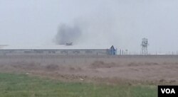 FILE - Smoke appears to rise from Qarchak women's prison near Tehran, in this photo first published online by Iranian Dervish news outlet Majzooban Noor on Feb. 8, 2019.
