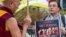 Member of the Tibetan Parliament in exile Thubten Wangchen, left, together with another protestor hold the Tibetan flag during the 'Flame of Truth' rally, near the European Commission headquarters in Brussels, September 20, 2012. 