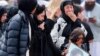 FILE - Mourners arrive for a burial service of a victim from the March 15 mosque shootings at the Memorial Park Cemetery in Christchurch, New Zealand, March 21, 2019. 