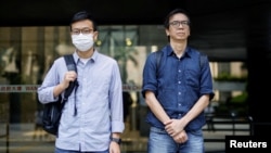 FILE - Chung Pui-kuen and Patrick Lam, both former chief editors of the now-defunct Stand News, leave court after a hearing on conspiracy charges in Hong Kong on June 27, 2023. Chung received a 21-month jail sentence on Sept. 26, 2024, but Lam was released for health reasons.